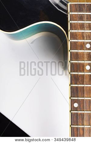 Fretboard With A Strings. Classic Acoustic Guitar On A White Background, Close-up.