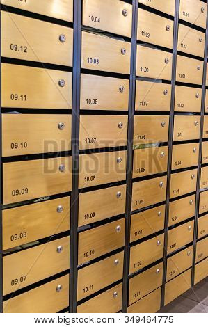 Vertical Photo Of Letter Mailboxes In Condominium Building