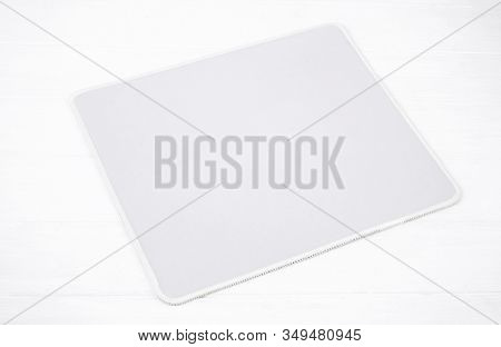 Blank napkin on white wooden table