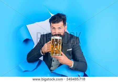 Bearded Man Holds Craft Beer Looking Through Paper Hole. Drinks, Alcohol, Leisure, People Concept. S
