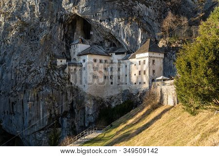 Predjama Castle Slovenia On A Bright Sunny Day (landscape Orientation)