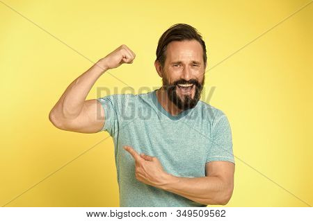 Fitness Result. Man Show On Muscle As Result After Fitness Training. Fitness Result Of Happy Man. Ma