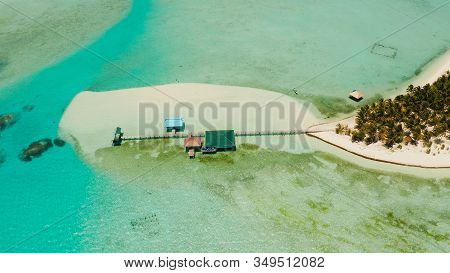 Tropical Island In The Ocean With Palm Trees On White Sand Beach. Onok Island, Balabac, Philippines.