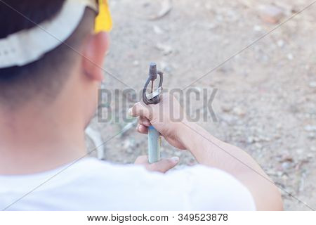 Worker Fixing Water Pipe Spinger In The Garden.