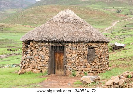 Traditional Stone Bungalow With Straw Roof Without People