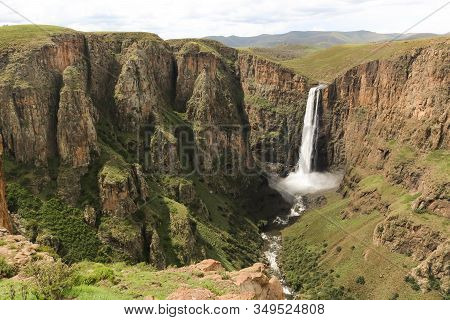 Stunning Waterfall Running Down A Steap Canyon