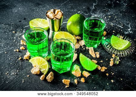 Strong Alcohol. Absinthe With Sugar, Ice Cubes And Lime Slices, Three Shot Glasses With Absinthe. Da