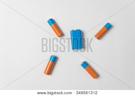 Aa And Pp3 Batteries On White Background. Batteries Of Different Types. Top View.