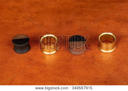 Group Of Four Whole Plug Line On Cognac Leather