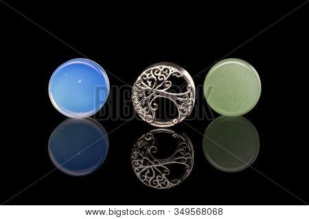 Group Of Three Whole Plug Isolated On Black Glass