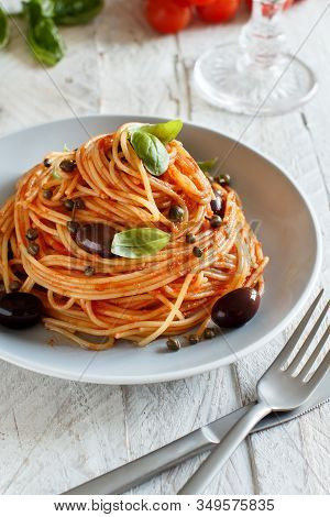 Pasta Alla Puttanesca - Spaghetti With Tomato Sauce Olives And Capers