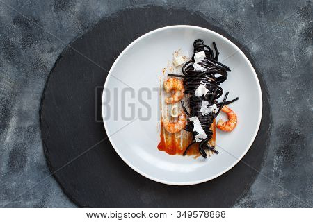 Squid Ink Black Spaghetti With Prawns And Tomatoes Top View