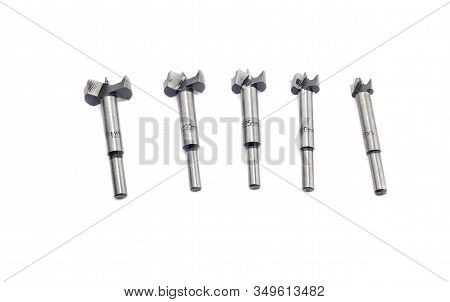 Instruments. The New, Modern, Set Of Five Various Forstner Bits For Wood On White Background Close-u