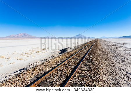 Train Tracks Perspective View From Bolivia. Bolivian Landscape. Salar De Colchani