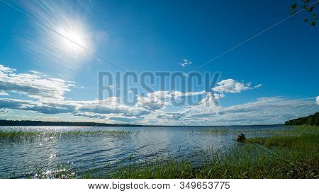 Sun Over Wild Lake. Nature Of Karelia. Shore Of Lake Ladoga, Russia. Republic Of Karelia. Northern N