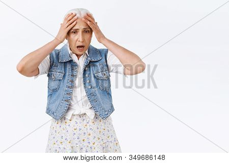 Shocked, Anxious Panicking Senior Woman Facing Fraud, Holding Hands On Head, Gasping Shook, Stare Do