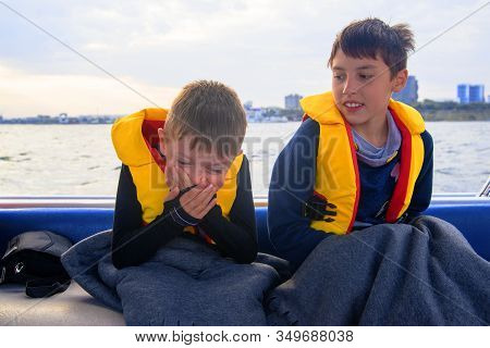 The Child Has Seasickness On The Boat.