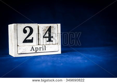 April 24th, Twenty-fourth Of April, Day 24 Of Month April - Rustic Wooden White Calendar Blocks On D