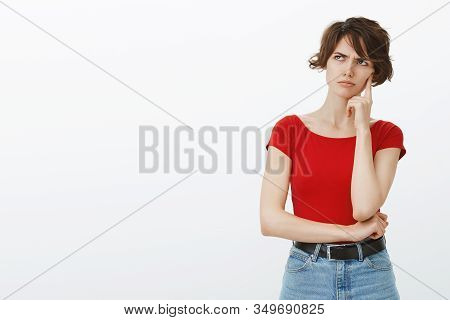 Perplexed Serious-looking Intense Young Woman Pondering Important Decision Frowning Look Up Process 