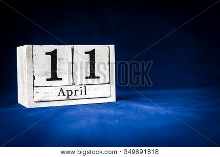 April 11th, Eleventh Of April, Day 11 Of Month April - Rustic Wooden White Calendar Blocks On Dark B