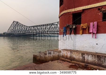 View Of Howrah Bridge From Mallik Ghat On Sunset In Kolkata. India
