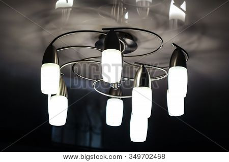 Chandelier With Long Plafonds On A Light Ceiling