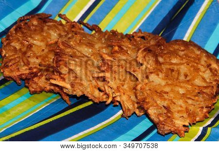 Potato Pancakes On A Blue Striped Background