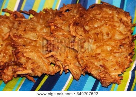 Potato Pancakes On A Blue Striped Background