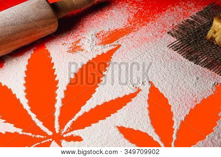 Cooking Cannabis Food. Trail Of Cannabis Leaf On White Flour On Lush Lava Color Table. Battledore. O