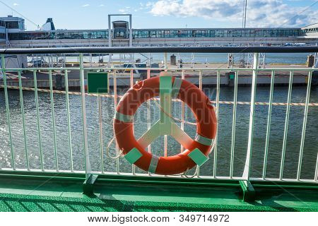 Lifebuoy On The Railing Of One Of The Decks Of A Tourist Ferry