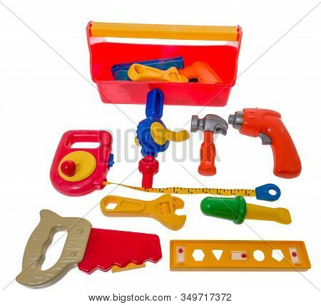 A Mixture Of Toy Tools Including A Tape Measure, Saw, Level, Cresent Wrench, Screw Driver, Drill, Ha