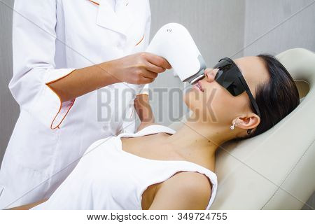 Laser Hair Removal With A Female Face Laser. Close Up Laser Hair Removal.