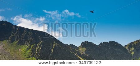 Red Helicopter Of Topr (polish Mountain Rescue Team) During Emergency Action In Tatra Mountains