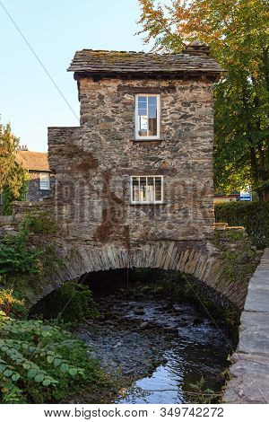 Ambleside, England - September 28:  Bridge House A 17th Century Old Stone Cottage Perched Over Stock