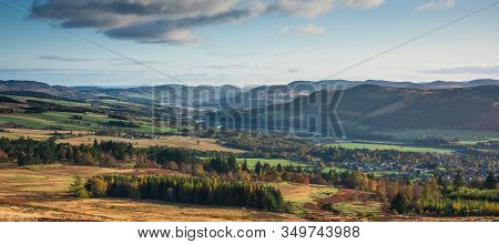 Panoramic View Of Pitlochry In Perthshire, Scotland - Heather Covered Hills, Meandering River, Mount