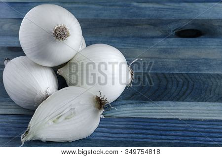 White Onion On A Blue Background Half Of A White Onion Close Up Place Under The Text