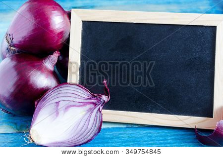 Red Onion Bulbs On A Dark Board Background Place Under The Text
