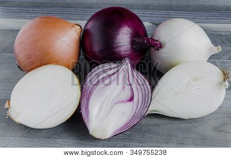 Large Bulbs Of Yellow, Red And White Onions Close-up Of The Bulbs In The Section