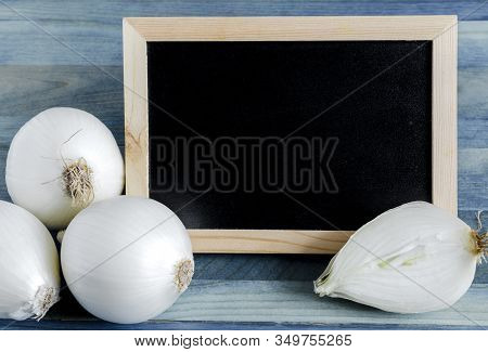 Large White Onion Bulbs Close Up On A Wooden Background Place Under The Text