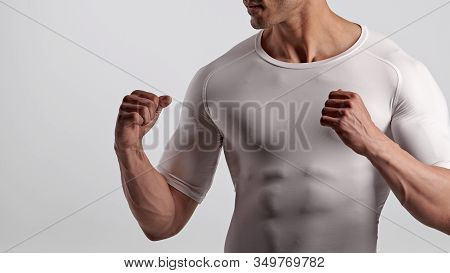 Strong Muscular Male Fighter Showing Fists, Closeup Photo