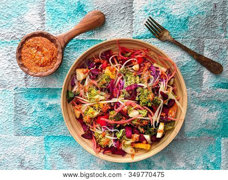 Fresh Salad Of Broccoli, Shredded Carrots, Apple, Red Cabbage, Beets, Radishes With Sesame Peanut Dr