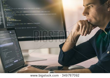 Developing Programming And Coding Technologies. Website Design. Programmer Working In A Software Dev