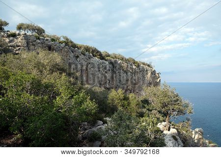 High Impregnable Plateau With Mountain Vegetation On Top And Slopes And Calm Sea Far And Down On Sky