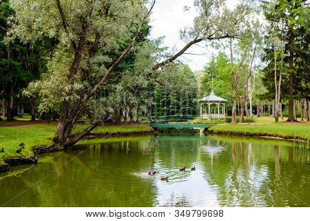 Sightseeing Of Narva. City Park. Beautiful Landscape - A Picturesque Pond With Gazebo, Narva-joesuu,