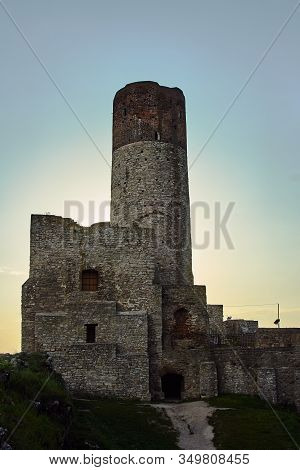 Stone Tower Of Ruined Medieval Castle In The Evening In Checiny, Poland