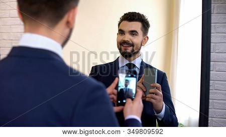 Cheerful Manager In Suit Taking Selfie In Mirror Reflection, Social Networking