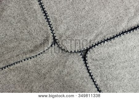 Gray Spathe Folded In An Envelope With Blue Threading Edges. Close-up Of Natural Warm Wool Coverlet,