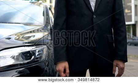 Personal Driver Standing Near Business Class Car Waiting For Vip Passenger