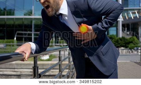 Businessman Has Heart Attack Outdoors, Spot Indicates Pain In Chest, First Aid