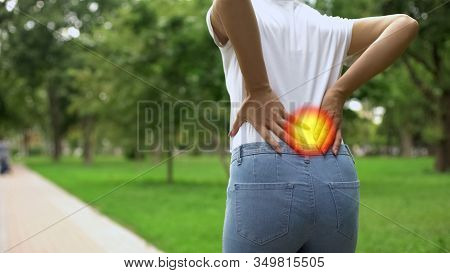 Woman Feels Back Pain When Walking In Park, Inflammation Of Kidneys, Arthritis
